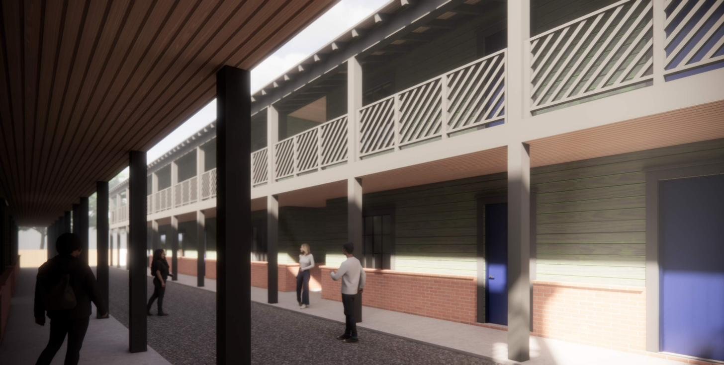 Rendering of a covered porch walkway along the apartments with blue front doors